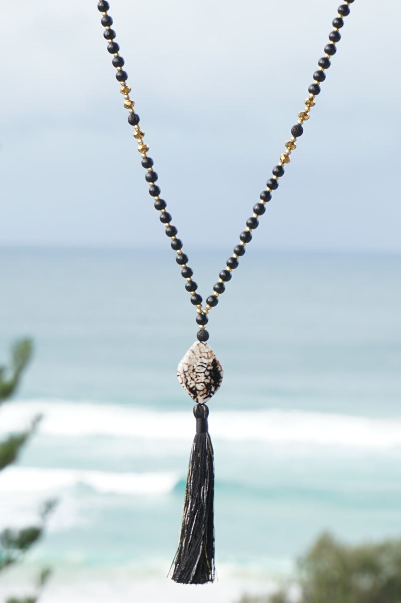 Gold pendant with tassel discount